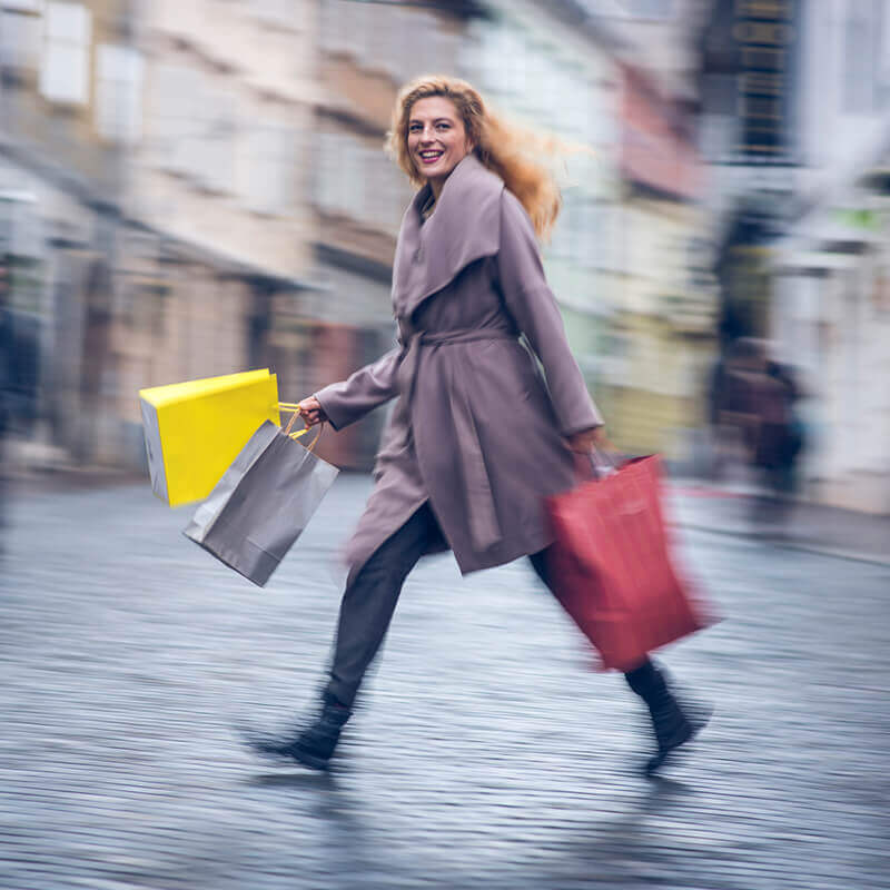 Woman walking with shopping bags