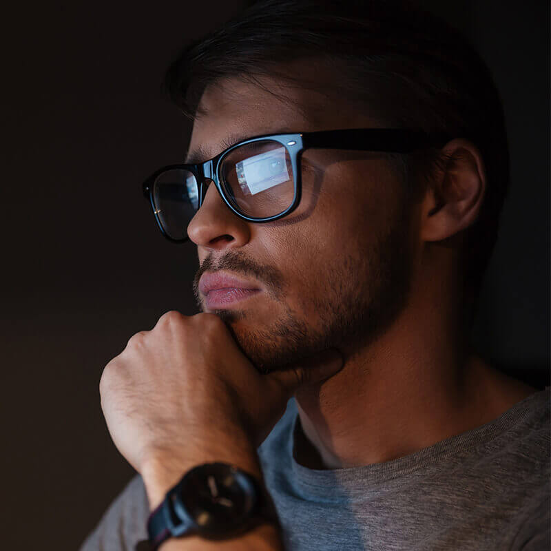 Man with reflection in his glasses
