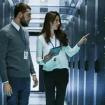 Two people in a server room
